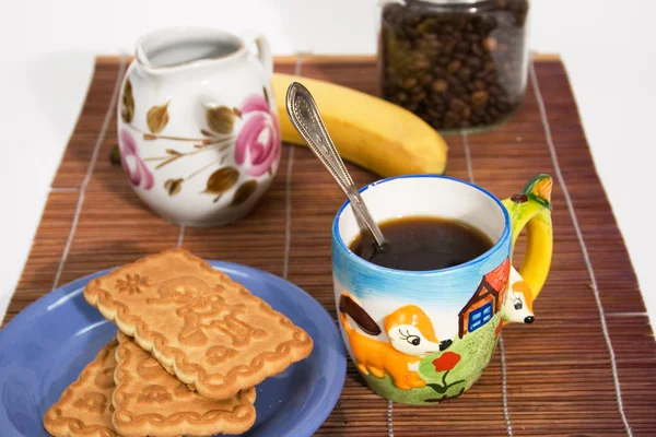 Cup of coffee and a snack — Stock Photo, Image