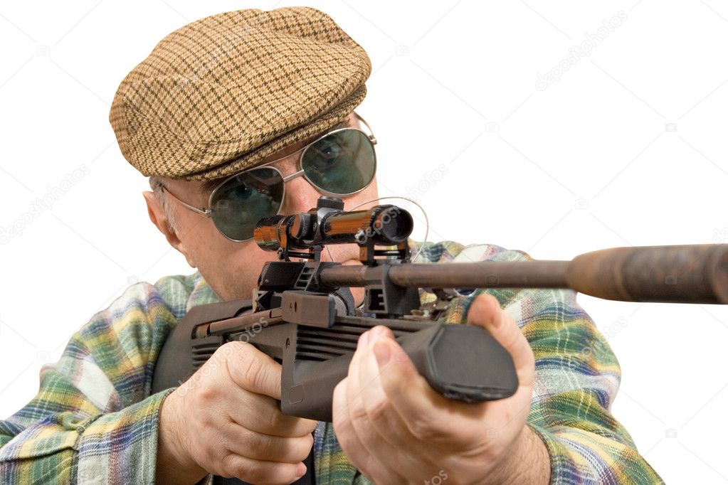 A man holding a rifle, looking into the optical sight. studio white background