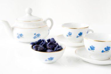 Tea with candied violets clipart