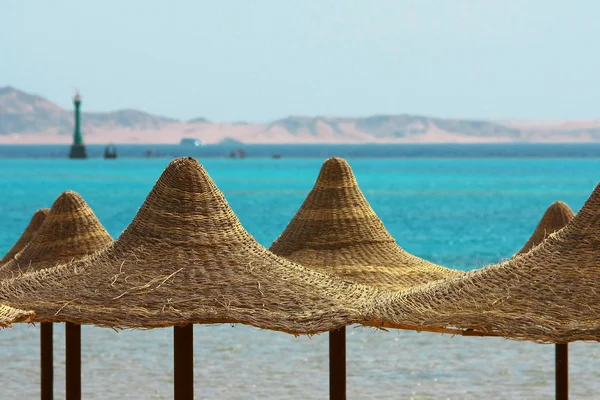 Umbrellas, Mount and Red Sea — Stock Photo, Image