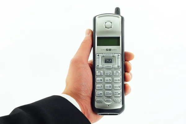 Draadloze telefoon in hand geïsoleerd op wit — Stockfoto