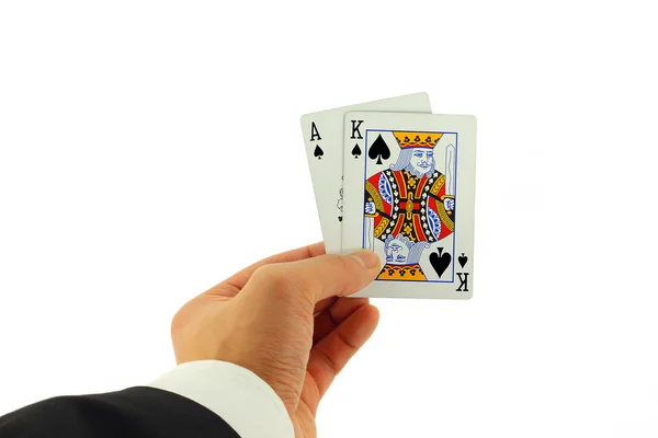 Mano della carta di blackjack isolata su bianco Foto Stock
