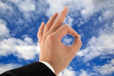 Hand Okay Sign In The Sky clipart