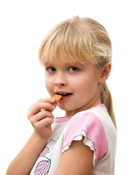 stock image Little girl eating cookies