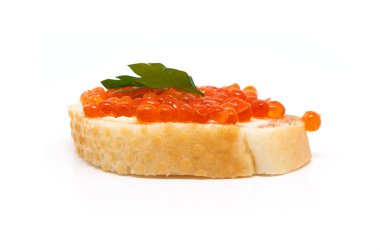 Red caviar on white bread, parsley on top clipart