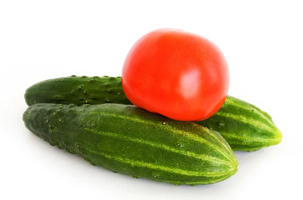 stock image Fresh cucumbers and tomatoes on white background