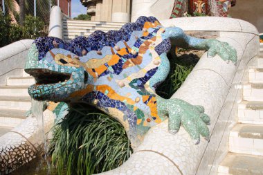 Famous mosaic lizard or dragon in Antoni Gaudi's Park Guell clipart