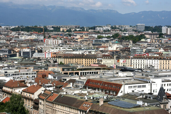 Cityscape of Geneva, Switzerland, seen from the top of cathedral. Alps in background.