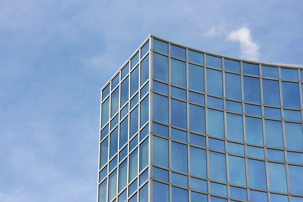 Skyscraper abstract in Geneve, Switzerland. Modern architecture exterior. Blue sky.