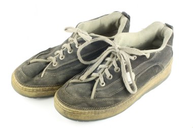 Pair of worn dirty shoes clipart