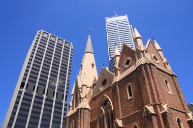 Perth, Australia. Abstract view of contrast between old and modern architecture. Wesley Church in foreground, skyscraper buildings in background. clipart