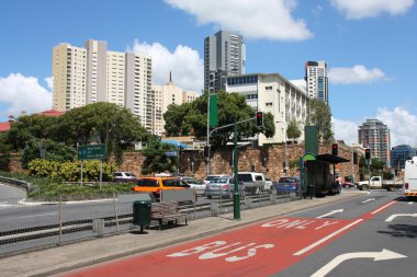 Brisbane, Australia - city street view with skyscrapers in background. Bus lane. clipart