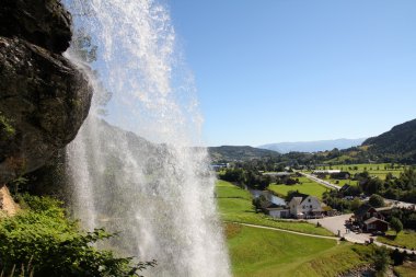 Norway, Hordaland county. Famous Steinsdalsfossen waterfall. Scandinavian nature. clipart