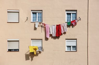 Colorful clothes. Drying laundry in Valladolid, Spain. clipart