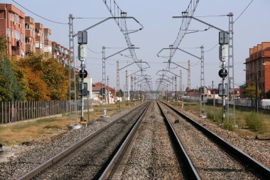Endless railroad tracks in Valladolid, Spain. Vanishing point phenomenon. clipart