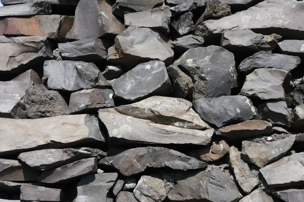 玄武岩の石の壁のバック グラウンド テクスチャ 抽象的なパターン — ストック写真