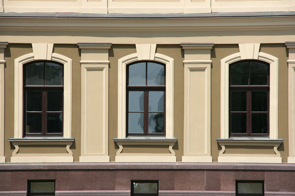 Three windows in old building in Kiev, Ukraine