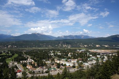 Radium Hot Springs, British Columbia, Canada. Mountain town with mountains in background. clipart