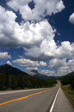 Road in Rocky Mountains. Highwood Trail - Kananaskis Country, Alberta, Canada. clipart