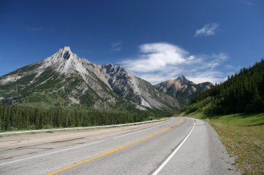 Kananaskis Country - Highwood Trail road and Rocky Mountains in summer. Alberta, Canada. clipart