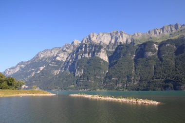 Switzerland - Walensee lake in canton St. Gallen with Churfirsten mountain range in background. clipart