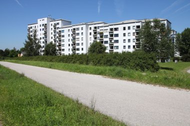 Typical contemporary suburban apartment buildings in Wels, Austria. Bicycle path in a foreground. Livable place.