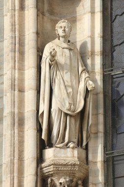 Saint Stephen, the martyr (or protomartyr - the first of martyrs). One of statues in the Cathedral of Milan (Italy). clipart
