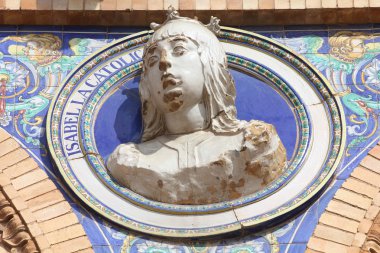 Bust of famous queen Isabel la Catolica in Plaza de Espana, Sevilla, Spain clipart