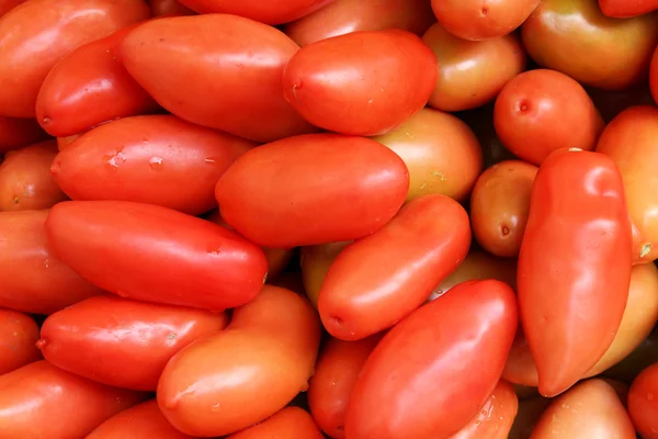 Tomaten Een Markt Voor Levensmiddelen Kraam Rode Achtergrond Textuur — Stockfoto