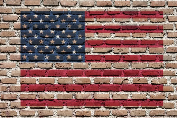 stock image United States of America (USA) national flag spray painted on a brick wall. Grunge graffiti.