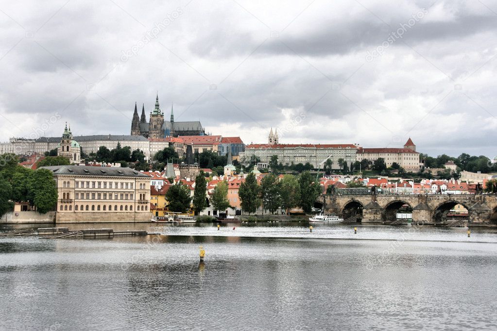 Beautiful cityscape of Prague, Czech Republic. Charles Bridge across the Vltava river. Mala Strana and Hradcany visible on the other side. Stormy weather. Part