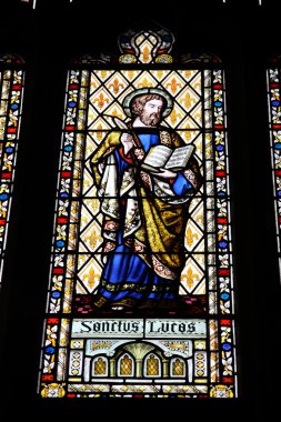 Coventry in West Midlands, England. Stained glass in the medieval Holy Trinity Church. Saint Lucas, the evangelist. clipart