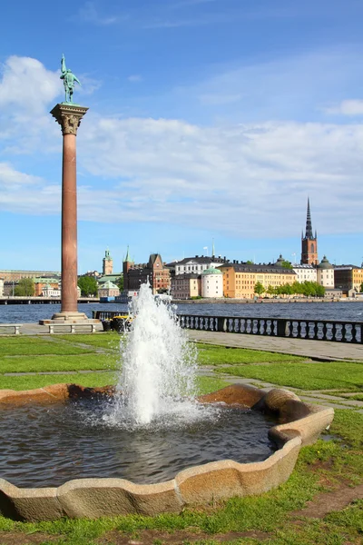 stock image Stockholm, Sweden. Column with famous Engelbrekt monument and Gamla Stan in the background.