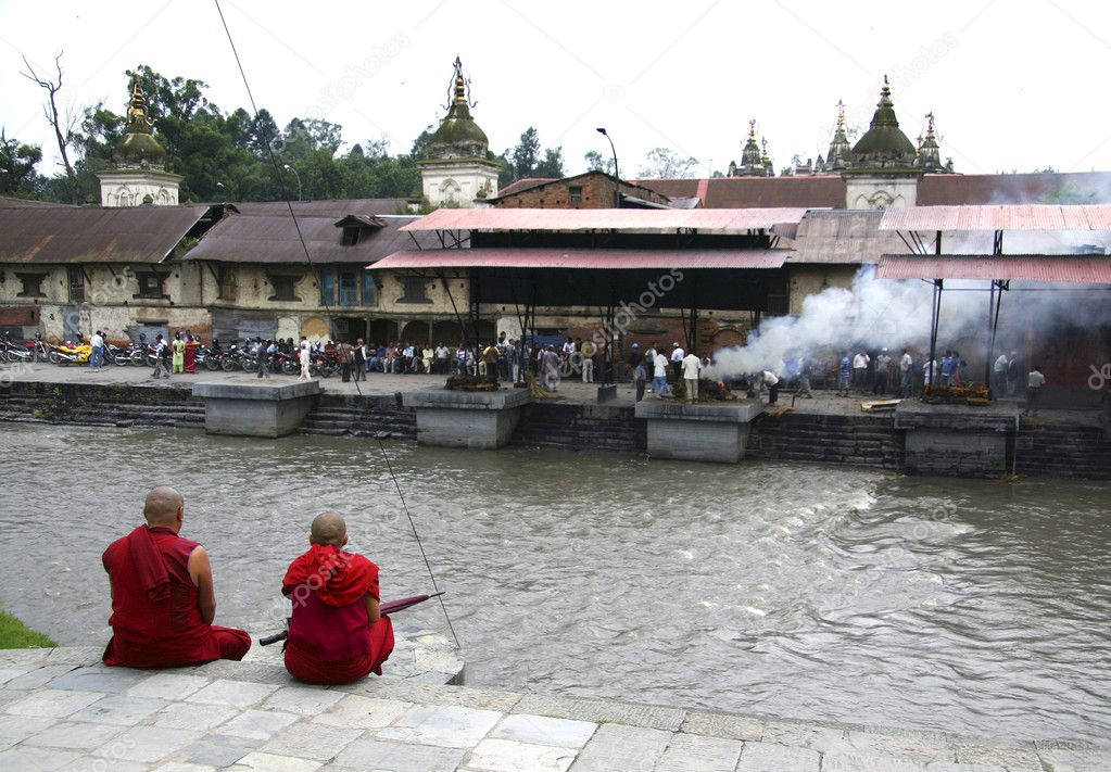 Monks sitting on the bank of Bagmati river in Pashupatinath, Nepal