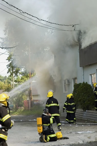 stock image Firemen on the move