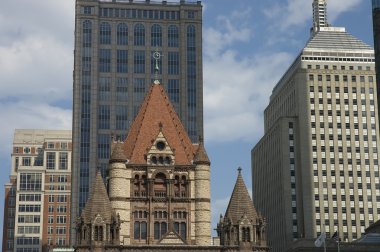 Bell tower of the Trinity church, Boston, Mass. The church made of granite and red sandstones, the low part based on Romanesque architecture clipart