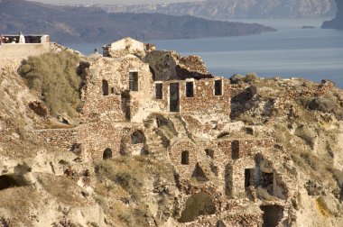 Ruins over the caldera of Crete island clipart