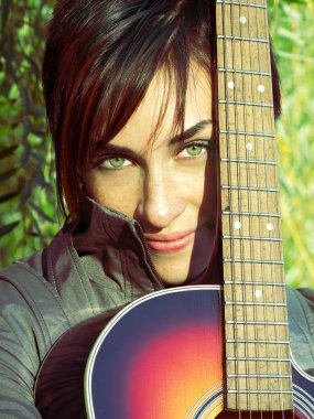 Beautiful green eyes girl with guitar clipart