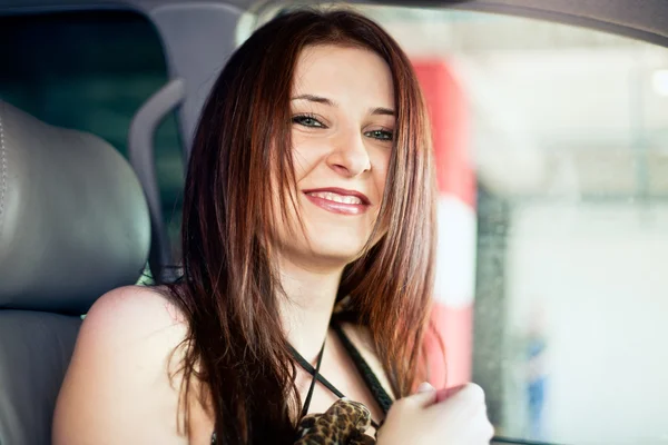 Beautiful brunette woman in car Stock Photo