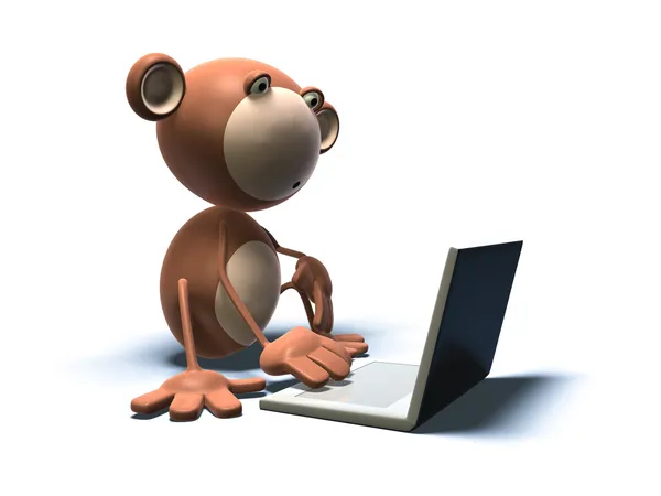 Scimmia davanti a un computer portatile — Foto Stock