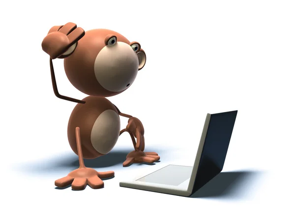 Małpa przed laptopa — Zdjęcie stockowe