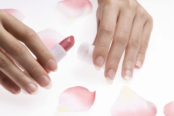 Finger läppstift och rose — Stockfoto