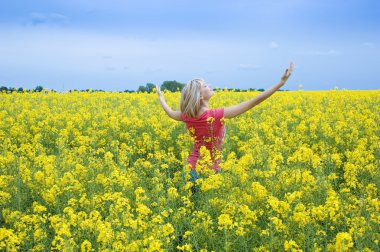 Happy girl in yellow field clipart