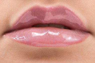 clse up of a red mouth with lipstick and lip gloss clipart