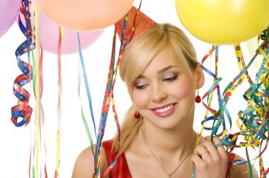 portrait of blond young woman between colored balloons and ribbons with a sweet smile clipart