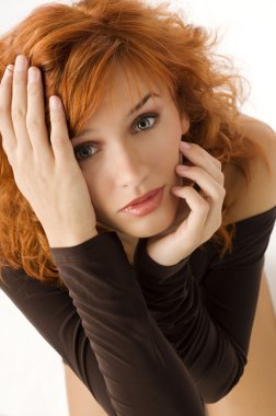 nive close up from top of red haired pretty woman looking in camera with expressive eyes clipart