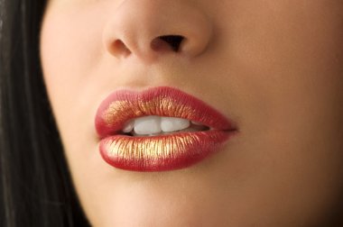 closeup of woman mouth with red and golden colored lips clipart