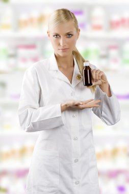 young blond woman as a nurse showing a madicine clipart