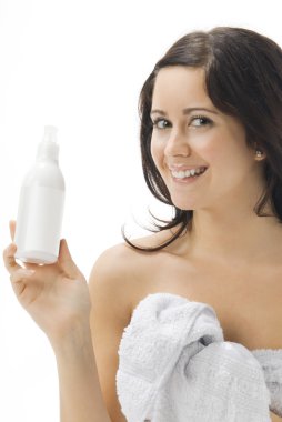 young and cute brunette with a white bottle where you can put your graphic showing it like an advertising clipart