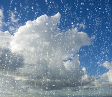 drops of rain with a cloudy blue sky in background clipart